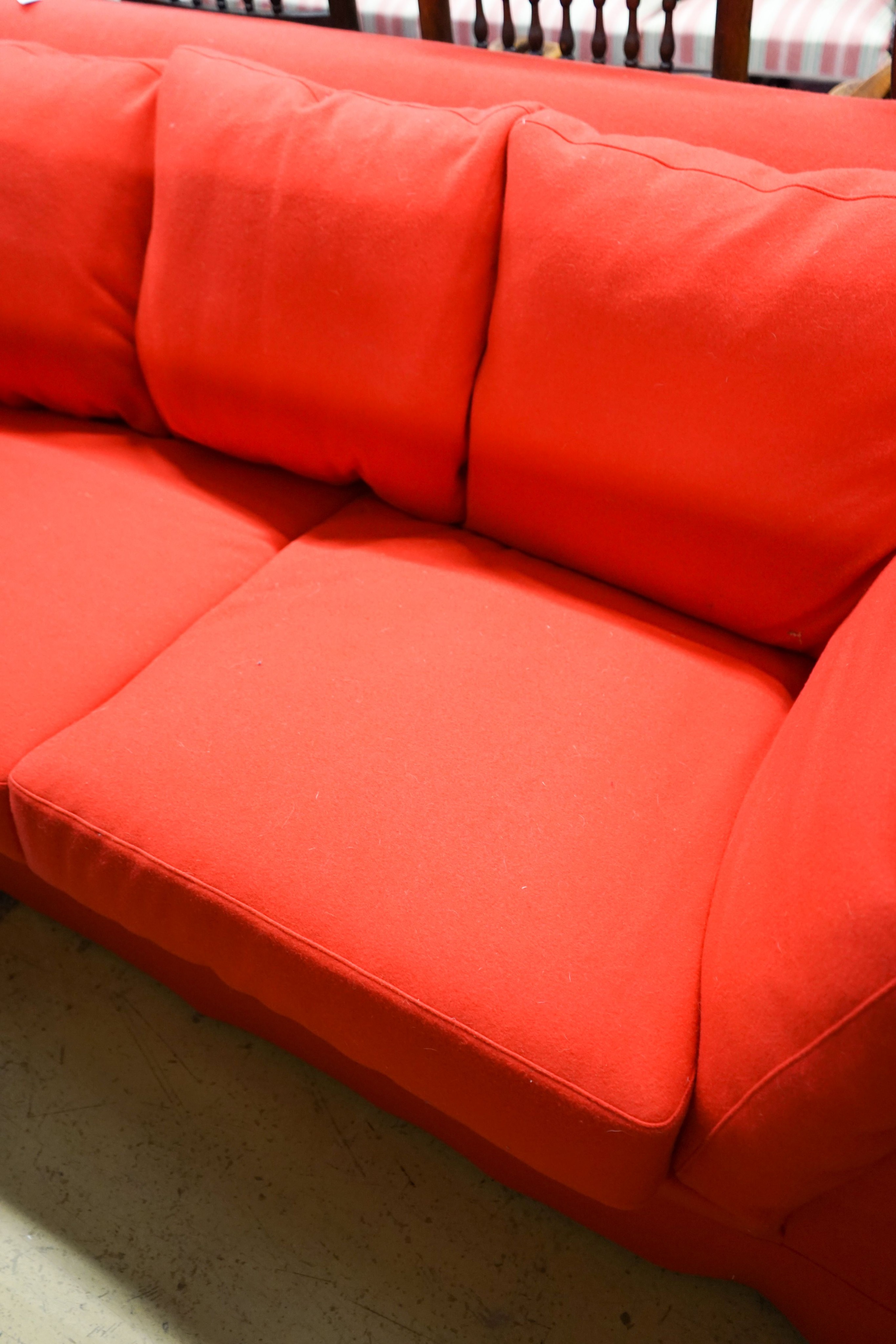 A contemporary Moroso three seater and two seater sofa upholstered in red fabric, the larger length 250cm, depth 100cm, height 79cm